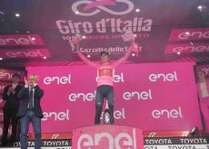 Geraint Thomas celebrates his Giro d'Italia lead on the podium