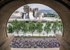 The Tour de France peloton passes by the Guggenheim Museum in Bilbao