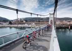 Paris-Nice peloton crosses bridge during stage 5