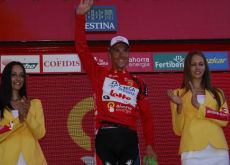 Philippe Gilbert celebrates his Vuelta lead on the podium with the beautiful Spanish podium girls. Photo copyright Fotoreporter Sirotti.