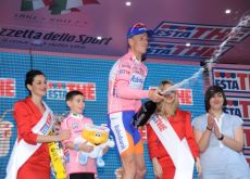 Pieter Weening celebrates his continued Giro lead on the podium. Photo Fotoreporter Sirotti.