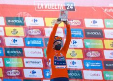 Primoz Roglic on the podium in the red jersey at La Vuelta