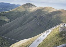 Professional cyclists in mountains during stage 20 of Vuelta a Espana 2024