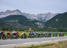 Tour de France cyclists passing by French mountains