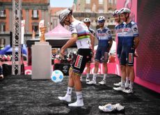 Remco Evenepoel playing soccer on the Giro d'Italia podium in Naples