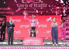 Remco Evenepoel is celebrated on the podium as leader of Giro d'Italia 2023
