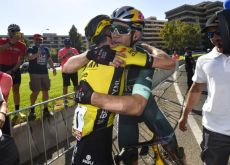 Sepp Kuss hugging Wout van Aert