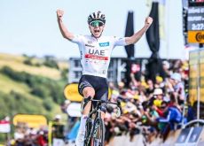 Tadej Pogacar crosses the finish line as winner of stage 20 of Tour de France 2023