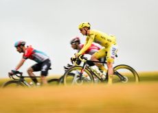 Tadej Pogacar riding on his yellow Colnago bike