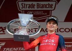 Thomas Pidcock with the Strade Bianche trophy