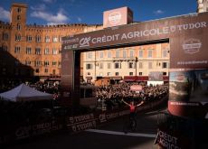 Thomas Pidcock crosses finish line in Strade Bianche