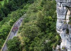Tour de France cyclists riding though mountain territory