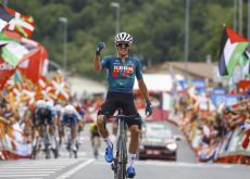 Urko Berrade raises hands as winner of stage 18 of Vuelta a Espana 2024