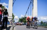 Tour de France cyclists crossing bridge
