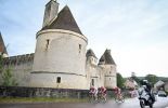 Stefan Bissegger Neilson Powless and Jonas Abrahamsen ride past a French castle