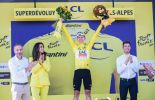 Tadej Pogacar on the Tour de France podium wearing yellow