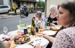 Women having dinner while watching cyclists in Tour de France 2024